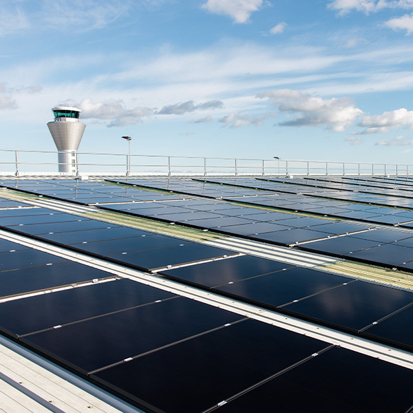 solar panels infront of jersey airport air traffic control tower